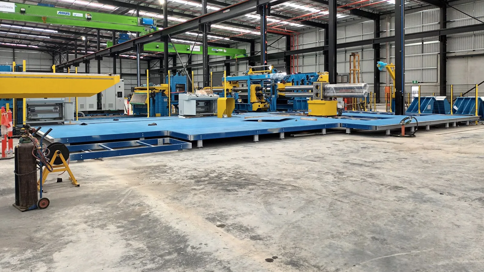 Machinery installed and aligned during a factory relocation