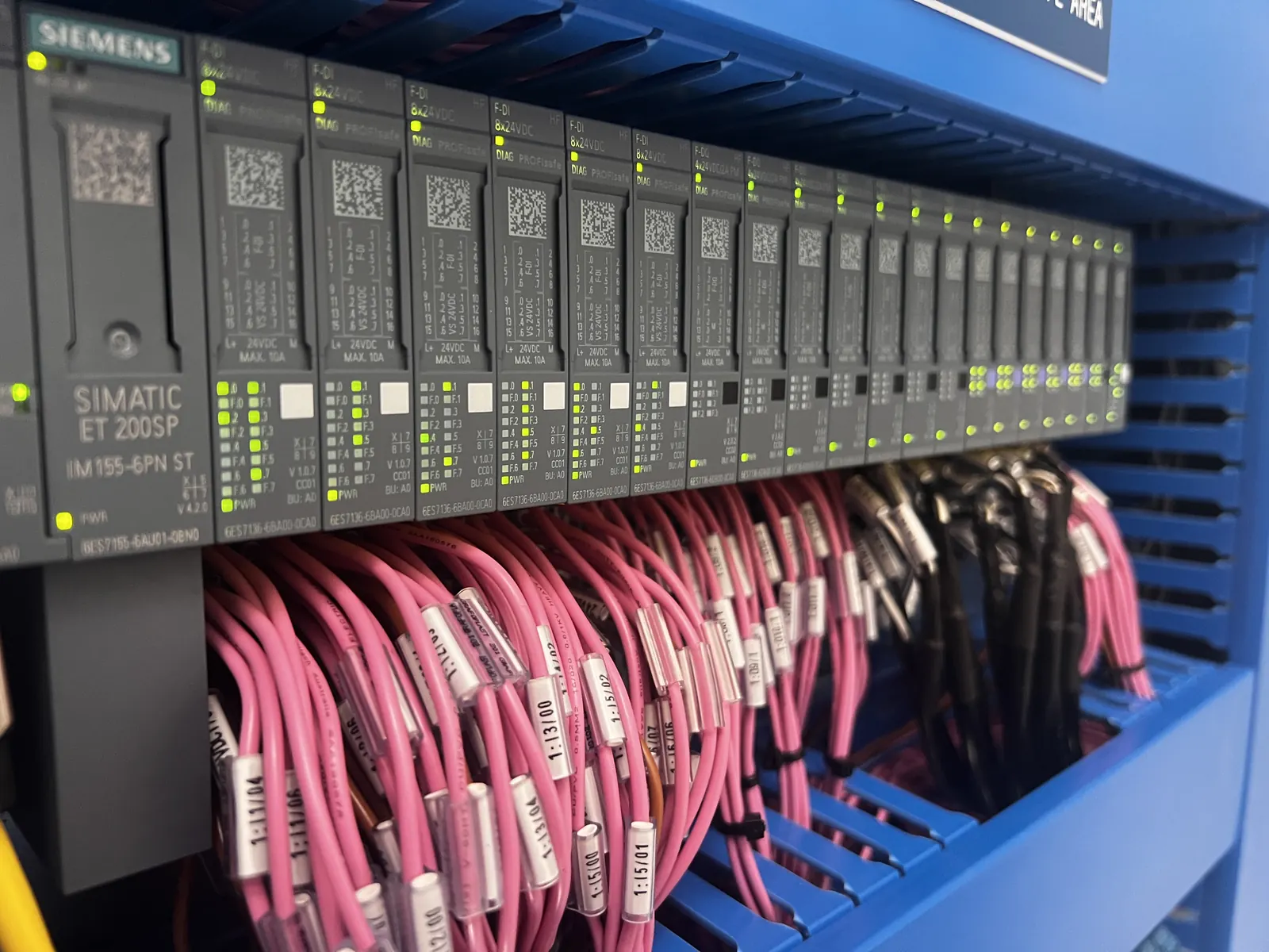 Close-up of an industrial PLC rack and I/O modules in a control cabinet