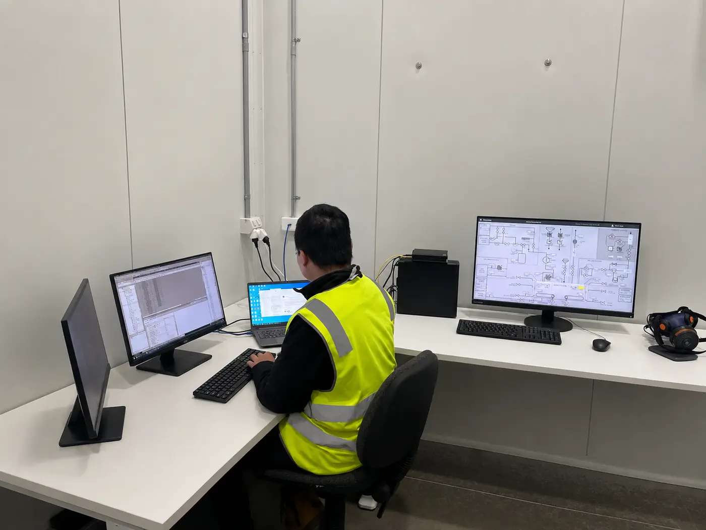 Automation engineer working on SCADA system screens
