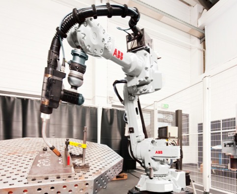 ABB robotic welding arm operating in an automated welding cell